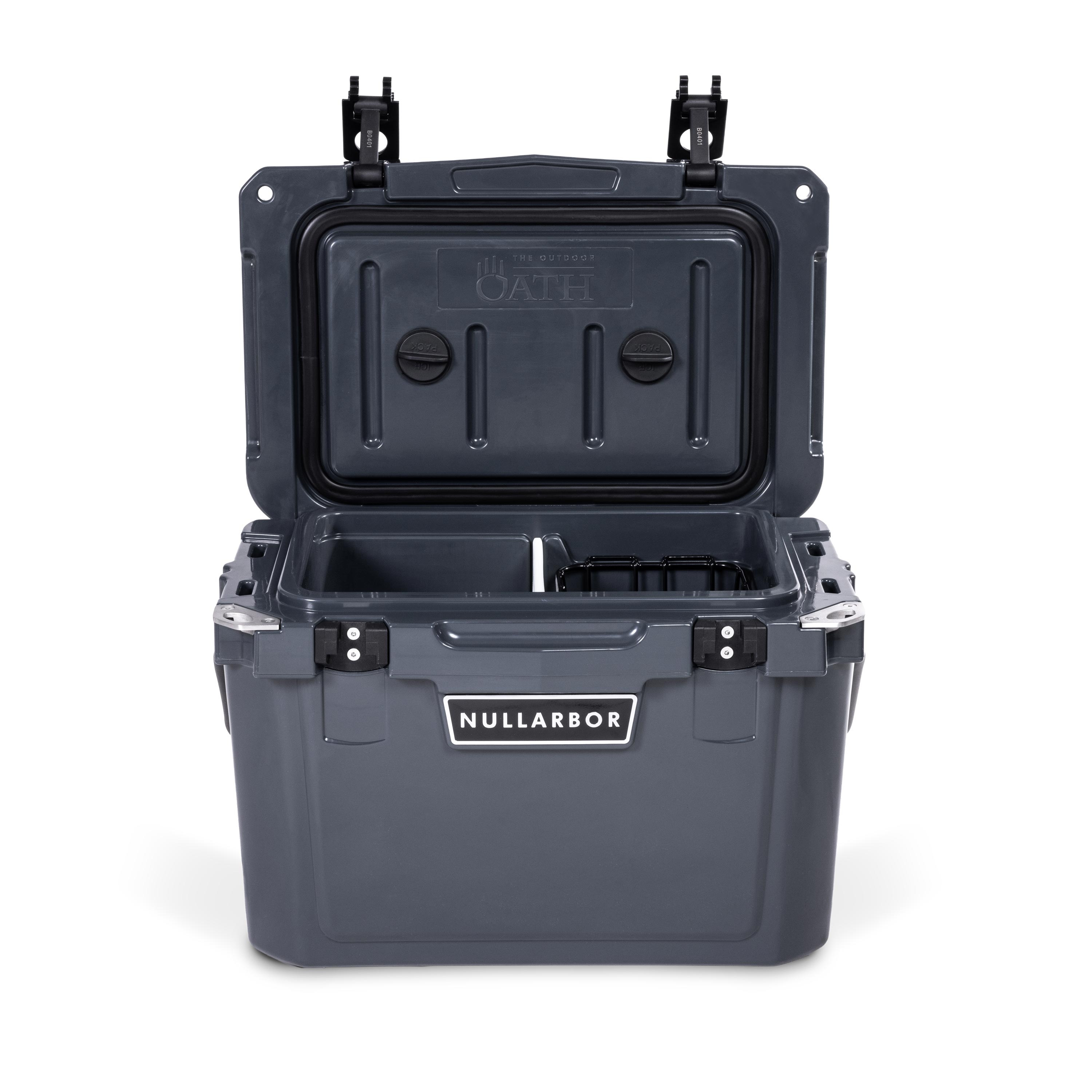 Front view of open small 19 litre dark grey cooler box with 2 easy lock latches on lid and bottle openers on each corner. Food divider / chopping board and wire food basket inside.