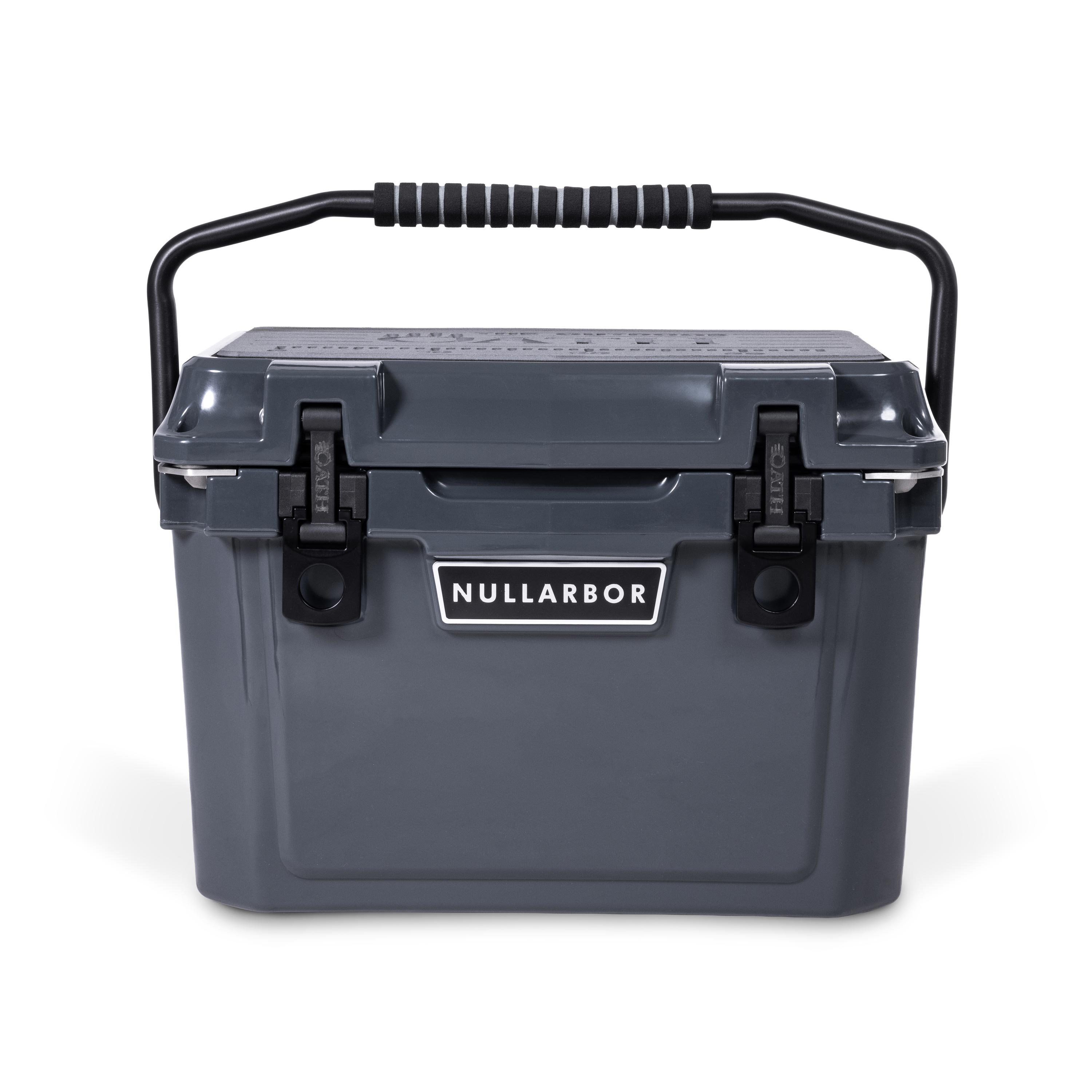 Front view of closed small 19 litre dark grey cooler box with carry handle, 2 easy lock latches on front and bottle openers on each corner. Grey foam mat on lid with fish catch ruler.