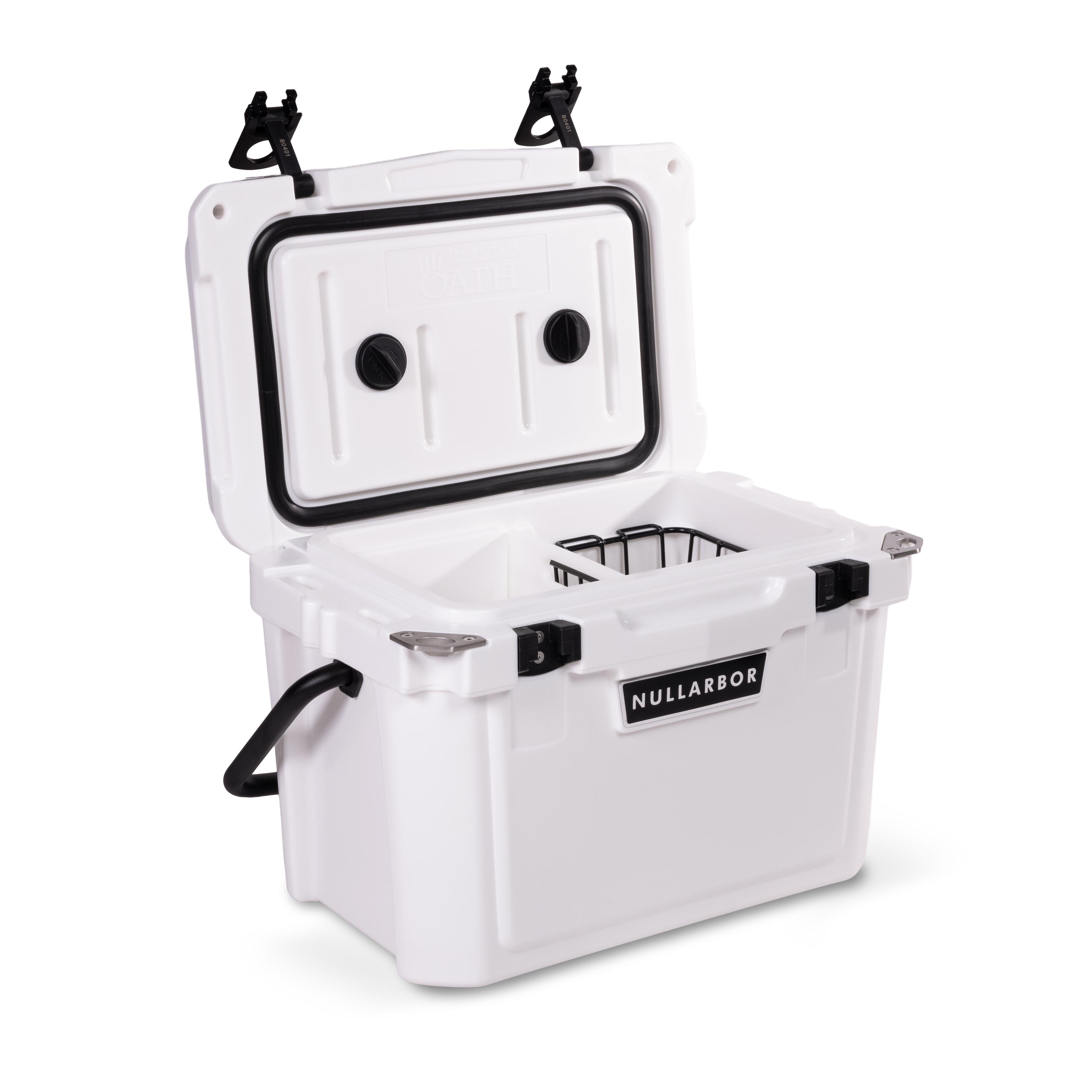 Left side 45 degree view of open small 19 litre white cooler box with carry handle, 2 easy lock latches on lid and bottle openers on each corner. Food divider / chopping board and wire food basket inside.