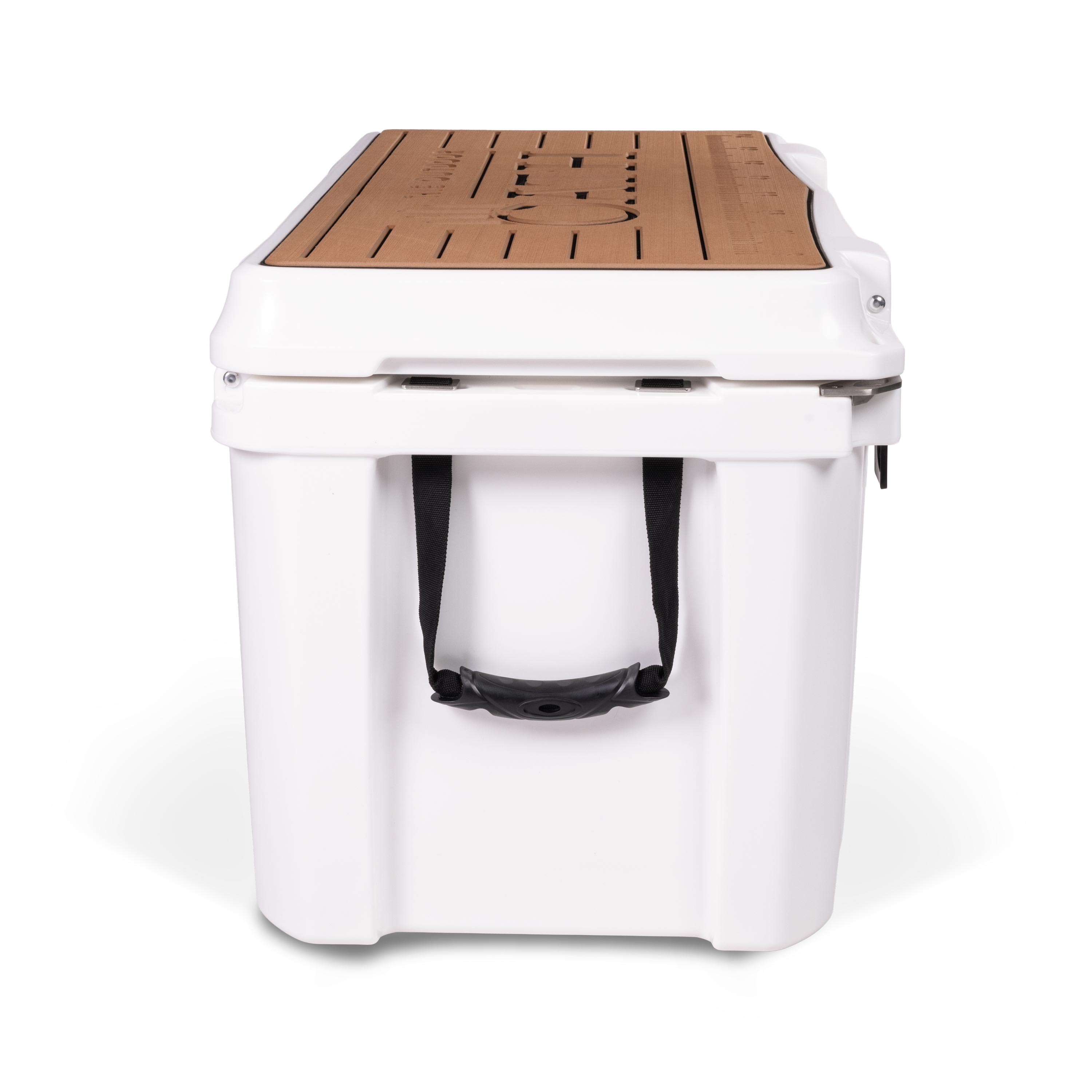 Left side view of closed large 71 litre white cooler box with side handle. Tan foam mat on lid with fish catch ruler.