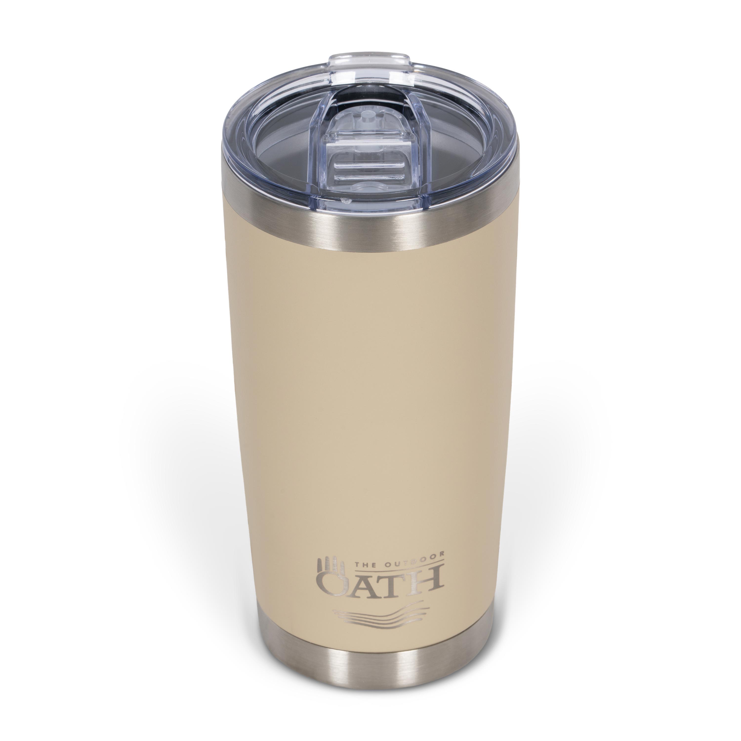 Front view from above of tan 590ml stainless steel drink tumbler with clear lid and silver etched outdoor oath logo and sand dune icon on side.