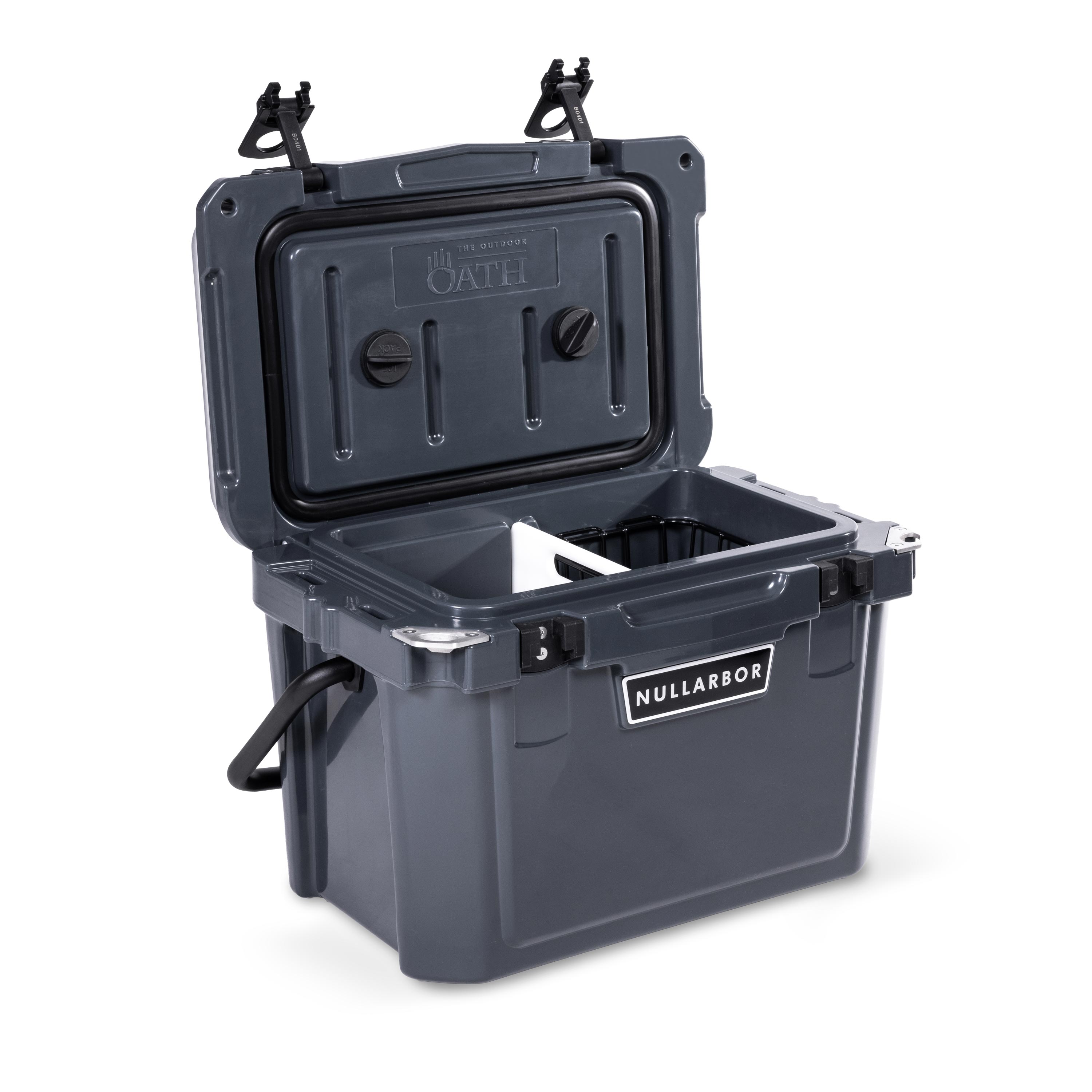 Left side 45 degree view of open small 19 litre dark grey cooler box with carry handle, 2 easy lock latches on lid and bottle openers on each corner. Food divider / chopping board and wire food basket inside.