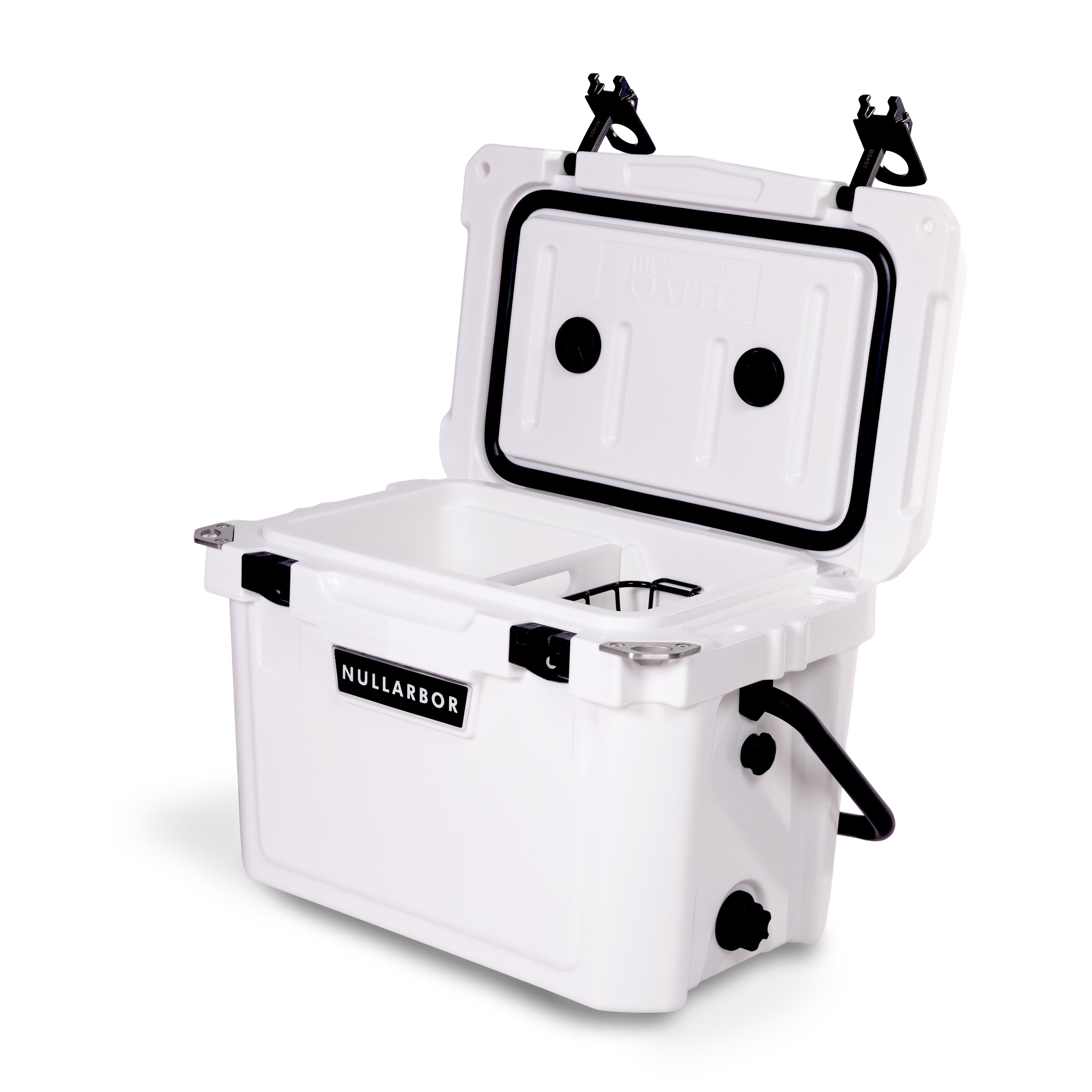 Right side 45 degree view of open small 19 litre white cooler box with side handle, 2 easy lock latches on lid, bottle openers on each corner. Pressure release valve and leak proof easy flow drainage plug on side. Food divider / chopping board and wire food basket inside.