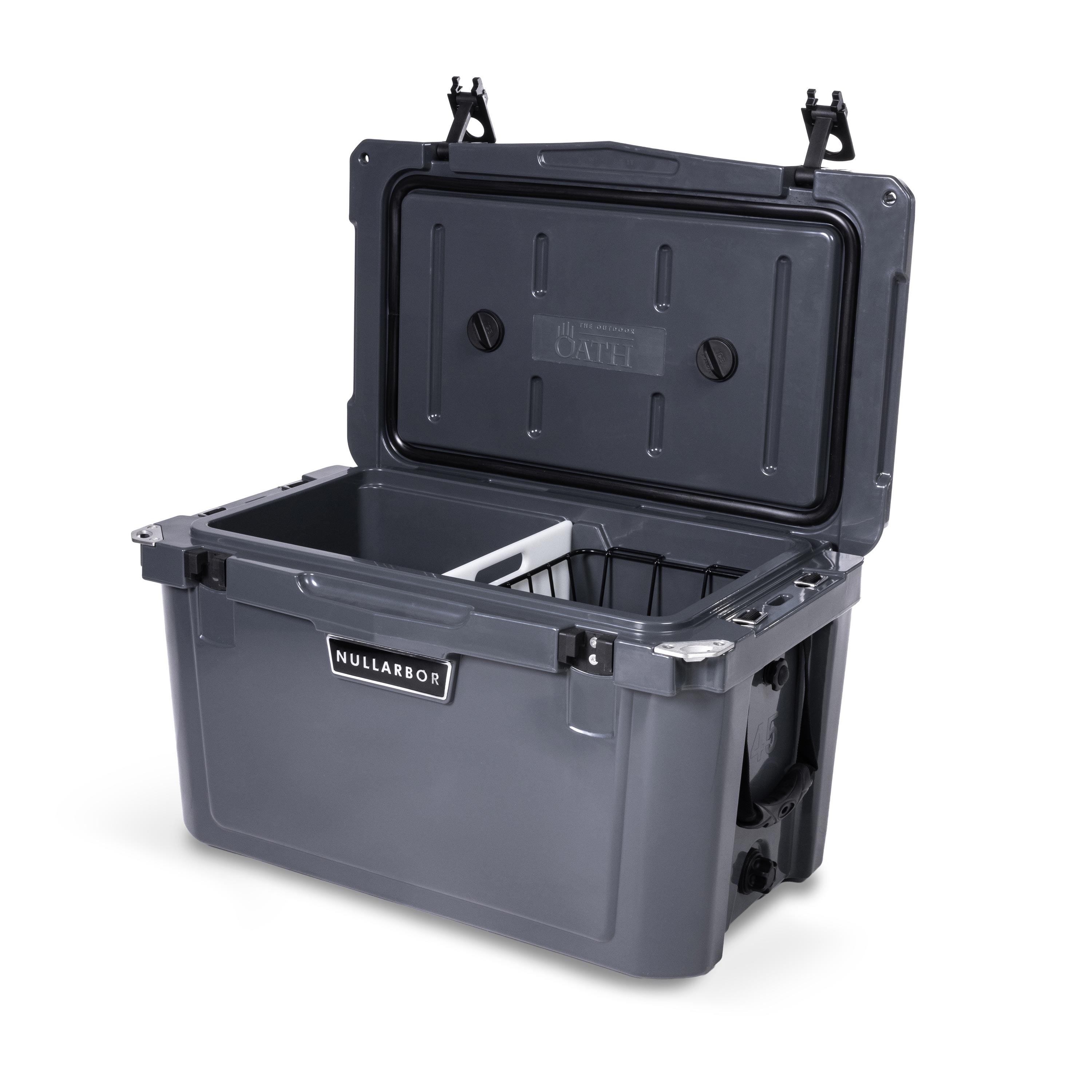 Right side 45 degree view of open medium 43 litre dark grey cooler box with side handle, 2 easy lock latches on lid, bottle openers on each corner. Pressure release valve and leak proof easy flow drainage plug on side. Food divider / chopping board and wire food basket inside.
