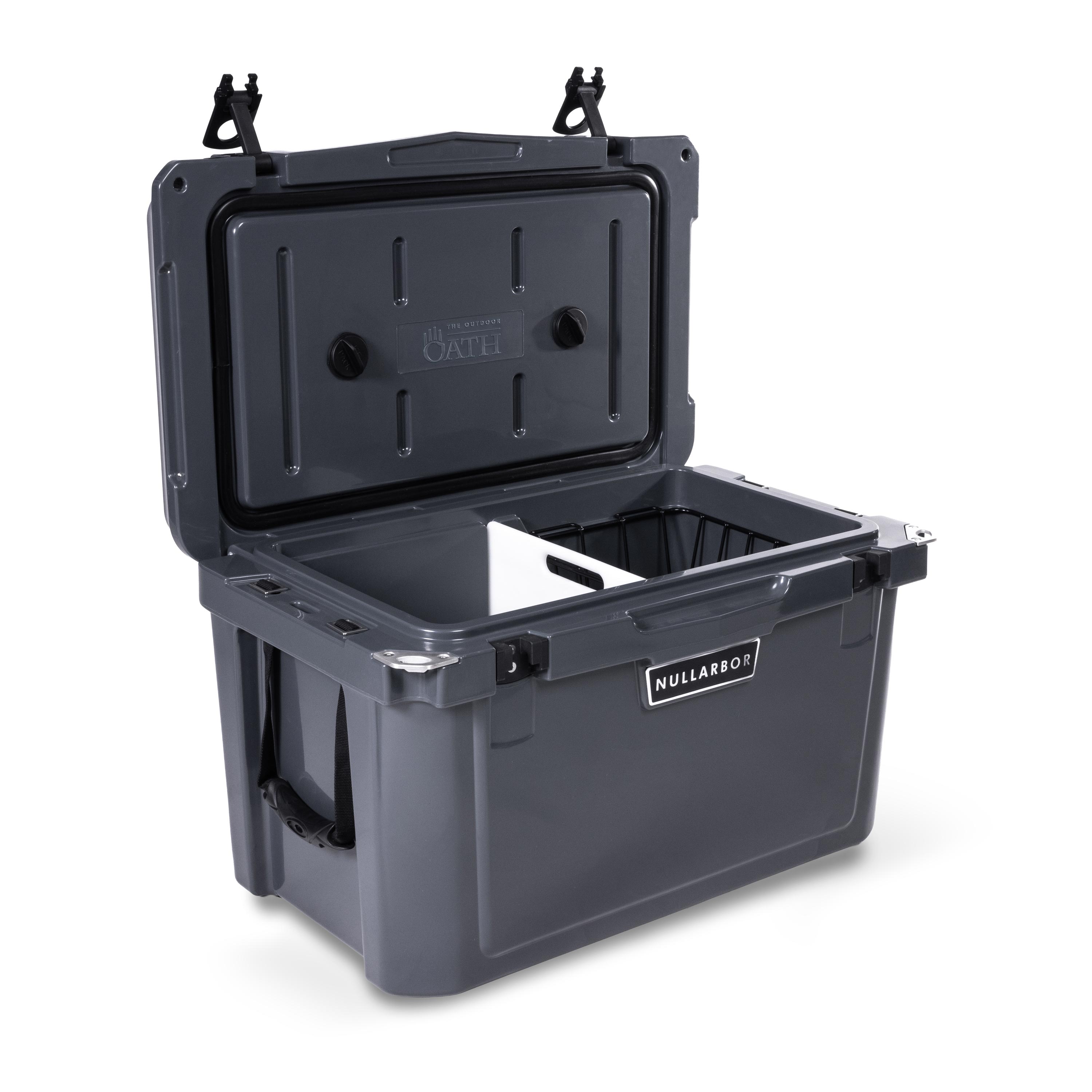 Left side 45 degree view of open medium 43 litre dark grey cooler box with side handle, 2 easy lock latches on lid and bottle openers on each corner. Food divider / chopping board and wire food basket inside.