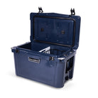 Right side 45 degree view of open medium 43 litre blue cooler box with side handle, 2 easy lock latches on lid, bottle openers on each corner. Pressure release valve and leak proof easy flow drainage plug on side. Food divider / chopping board and wire food basket inside.