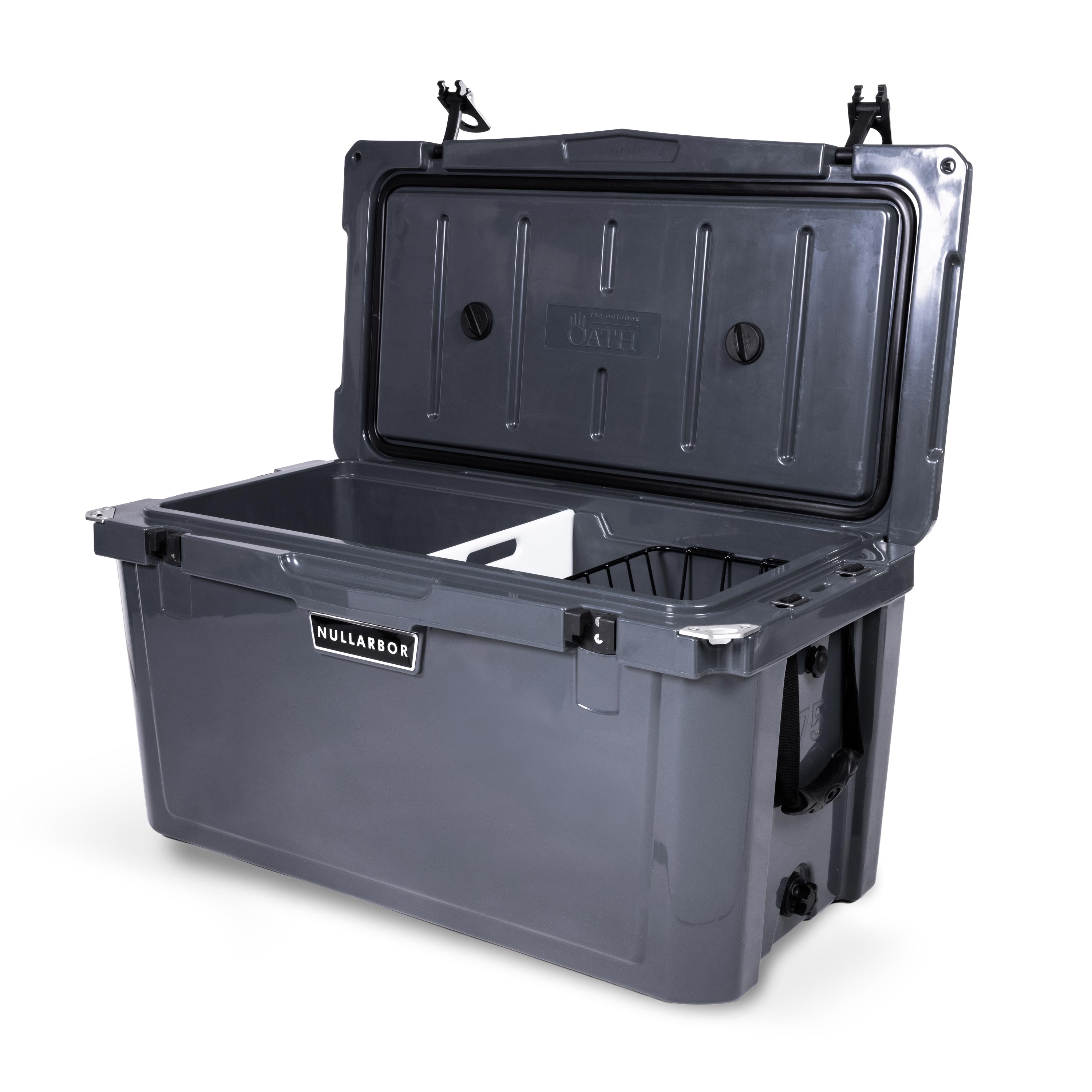 Right side 45 degree view of open large 71 litre dark grey cooler box with side handle, 2 easy lock latches on lid, bottle openers on each corner. Pressure release valve and leak proof easy flow drainage plug on side. Food divider / chopping board and wire food basket inside.