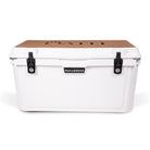 Front view of closed large 71 litre white cooler box with 2 easy lock latches on front and bottle openers on each corner. Tan foam mat on lid with fish catch ruler.