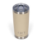 Front view from above of tan 590ml stainless steel drink tumbler with clear lid and silver etched outdoor oath logo and sand dune icon on side.