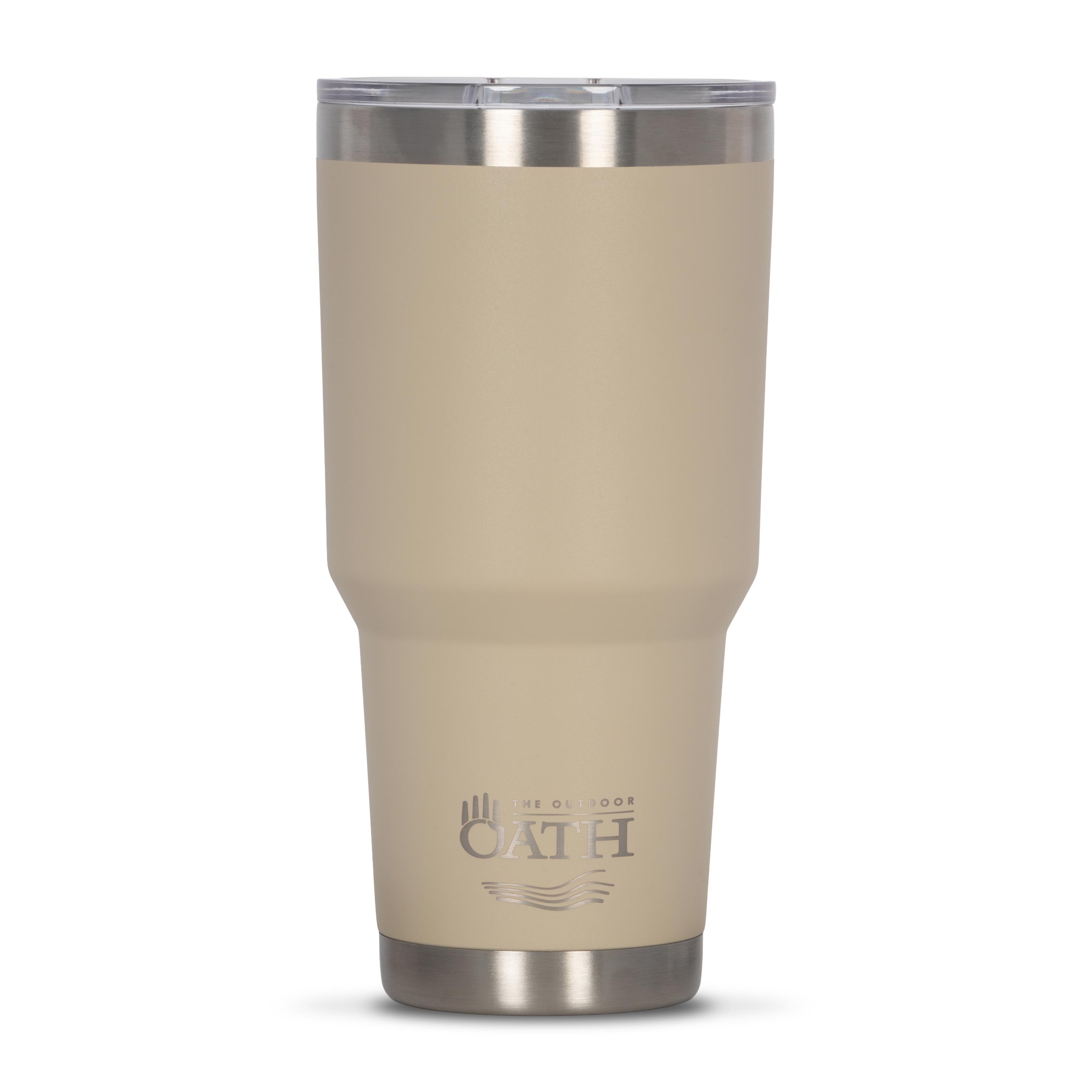 Front view of tan 890ml stainless steel drink tumbler with clear lid and silver etched outdoor oath logo and sand dune icon on side.